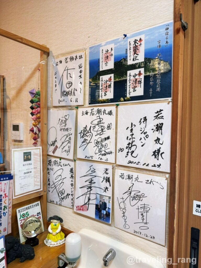Live squid and fish tanks at Genkai Wakashiomaru seafood restaurant near Fukuoka