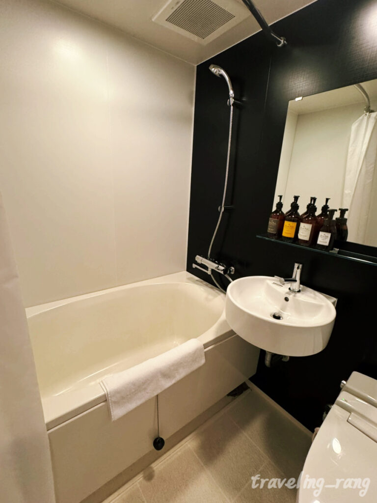 Standard Twin Room with orange interior at WBF Grande Hakata