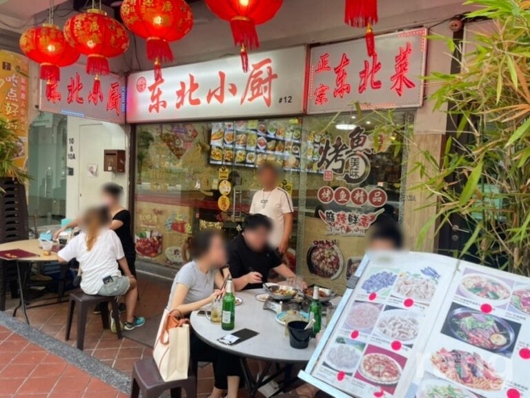 Budget restaurant Chinatown Singapore exterior with outdoor seating