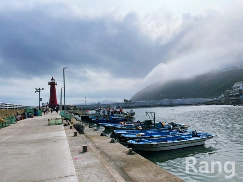Cheongsapo red lighthouse on the harbor breakwater